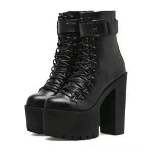 Black lace-up gothic platform ankle boots front three-quarter view showing metal eyelets and ankle buckle strap detail