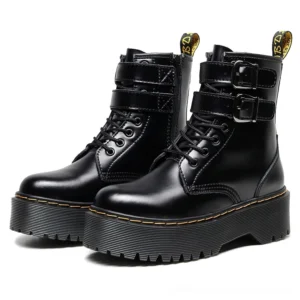 Black gothic platform combat boots with dual adjustable buckle straps, three-quarter front view showcasing glossy PU leather and chunky platform sole