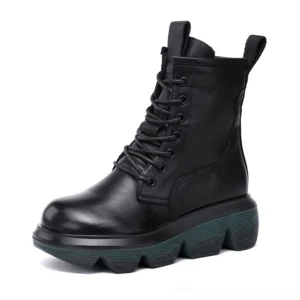 Black leather gothic platform combat boots with lace-up front and thick lug sole, side three-quarter view
