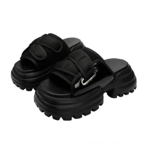 Black alternative platform mule sandals with thick platform sole and mesh upper, studio shot