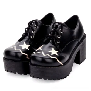 Black celestial lace-up platform oxford shoes with embroidered star details, front view showing pair