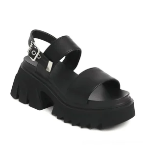 Black gothic platform chunky sandals with adjustable metal buckle straps and serrated sole, studio close-up view