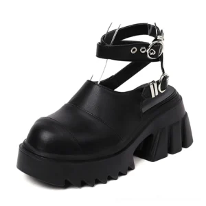 Black gothic platform sandals with adjustable metal buckle straps and chunky lug sole - front three-quarter view