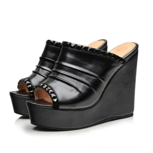 Black gothic platform wedge sandals with pleated PU leather and studded toe trim, front three-quarter view