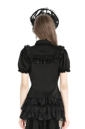 Gothic black blouse back view on model, displaying ruffle back yoke detail and short puff sleeve construction