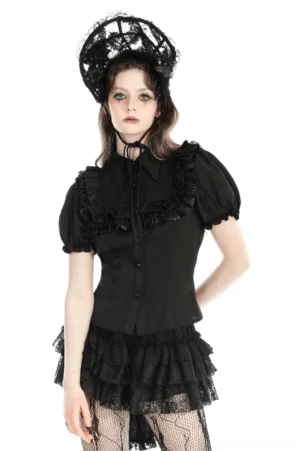 Black gothic puff sleeve blouse with ruffle collar front view on model, showing structured silhouette and layered ruffle trim