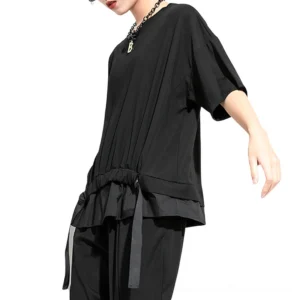 Black half-sleeve gothic tee, side three-quarter view on model, round neckline, drawstring waist detail visible