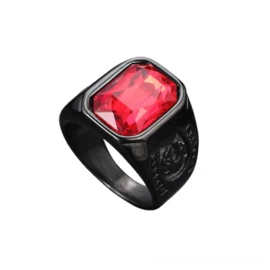 Minimalist black gothic ring with red gem stone displayed overhead, side profile showcasing band embossed details