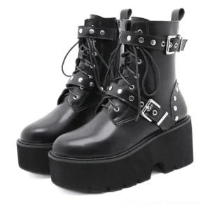 Black gothic combat boots with rivets and metal buckle straps, front view on white background