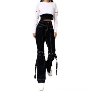 Woman wearing black gothic rivet flare trousers with cropped cutout top front full view alternative fashion
