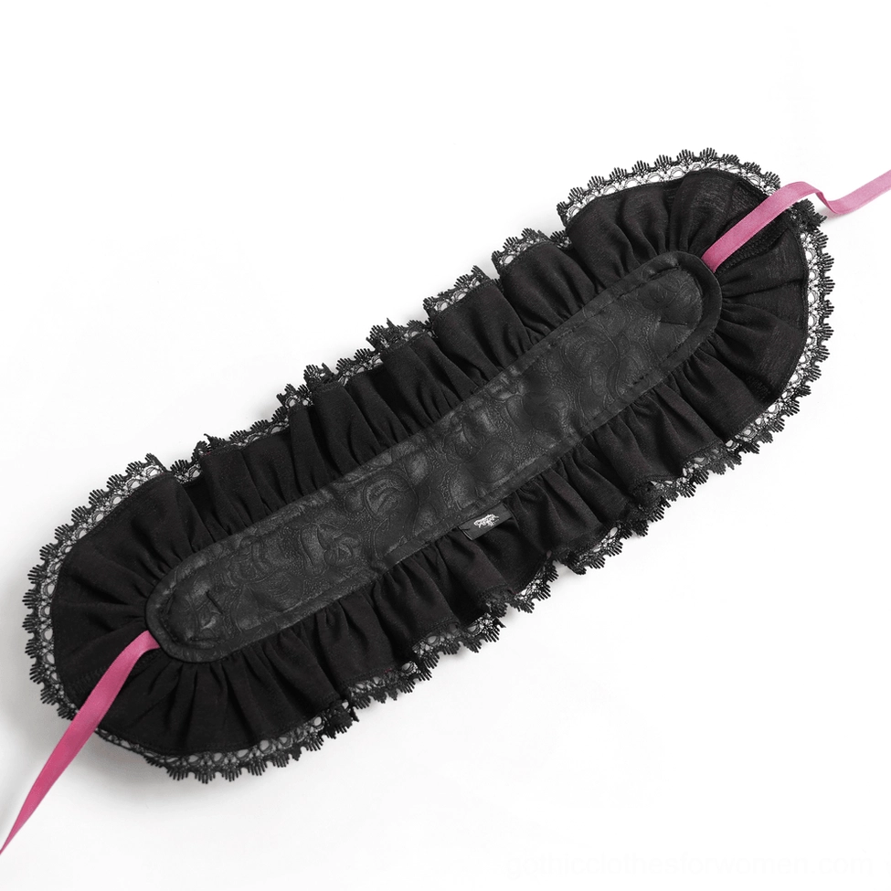 Flat lay back view of gothic bonnet showing black ruffled lace construction and ribbon tie fastening detail