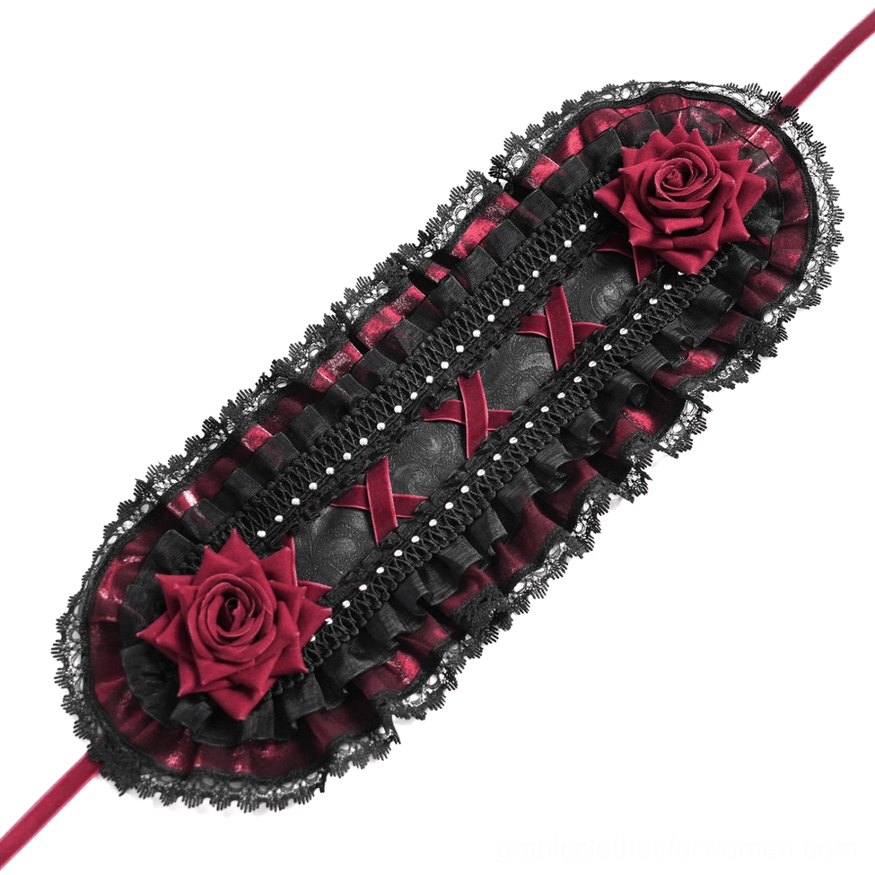 Flat lay front view of black gothic bonnet accessory showing wine-red roses, layered lace ruffles, and pearl studs
