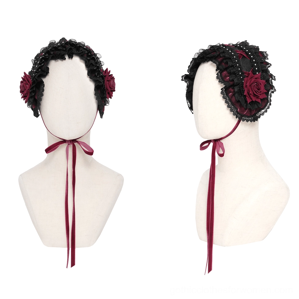 Front view of black gothic rose bonnet on mannequin displaying dual wine-red roses and ribbon tie closure
