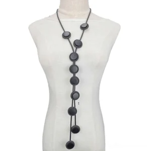 Black matte round Y-shaped gothic pendant necklace with soft black rubber rope chain, displayed on white mannequin front view