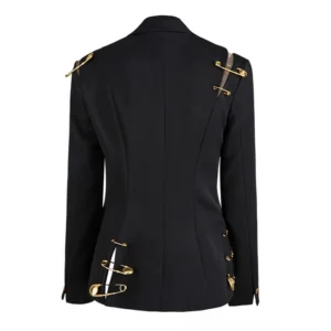 Black gothic blazer rear view showing gold safety pin decorations on shoulders and slit hem - back detail of women's alternative fashion jacket