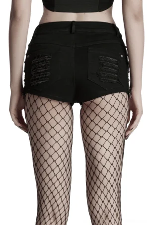 Back view of black gothic distressed denim shorts on model, displaying distressed back pockets and authentic ripped denim finish