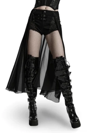 Black gothic shorts with detachable chiffon cape worn by female model, front three-quarter view showcasing mesh panels and fishnet details