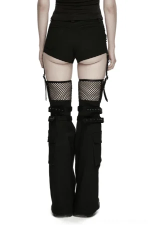 Back view of black gothic shorts with detachable flared legs showing low-rise construction and buckle strap details on model