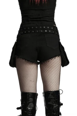Back full-body shot of gothic lace-up denim shorts showing double waist belts, raw cut hems, and rear patch pockets