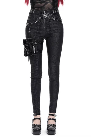 Black gothic snake texture skinny pants worn by model with red hair, front full-body view with detachable thigh pouch and adjustable buckle straps