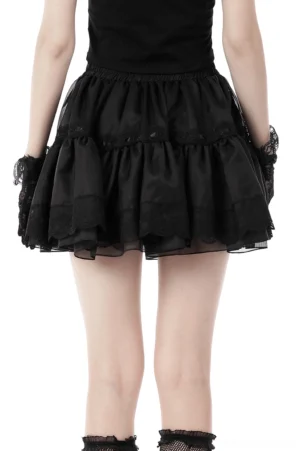 Gothic lace skirt back view showing sheer overlay and ruffled tulle hem on model