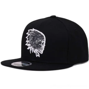 Black flat brim snapback baseball cap with white embroidered skull logo side angle