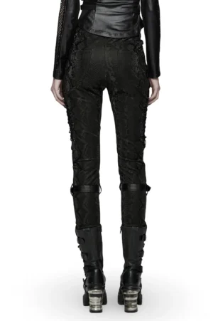 Black gothic snake print trousers rear view showing calf strap details and patchwork construction