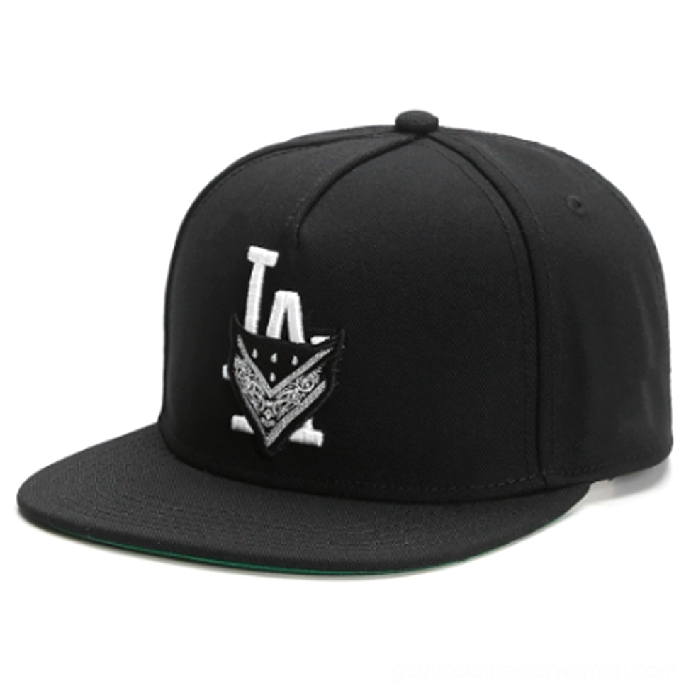 Black gothic snapback cap front three-quarter view with white LA embroidered badge logo and green underbrim detail