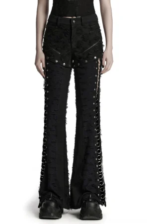 Black gothic split-leg pants with metal O-rings front view on model - tattered rose texture distressed flared trousers