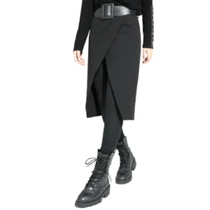 Black gothic split skirt pants with wide leather belt - front full body view on female model showing asymmetric midi hem