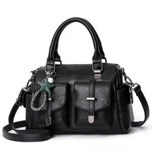 Black gothic star pendant leather handbag with dual front pockets, detachable strap, and celestial charm - front view