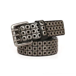 Black studded leather gothic belt with silver double-prong buckle and square metal grommets, displayed at oblique angle on white studio background