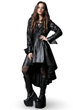 Black asymmetrical gothic tailcoat with hood and button front on female model, white studio background, high-low hemline visible