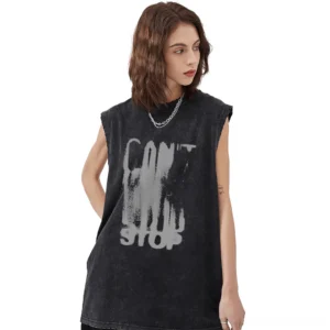 Model wearing black washed cotton gothic tank top with distressed CAN'T STOP letter graphic print, three-quarter view
