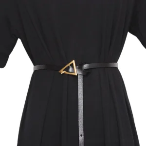 Black geometric triangle buckle gothic belt with gold metal hardware, worn on mannequin showing front waist detail