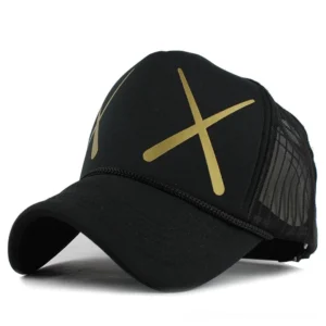 Black gothic mesh trucker baseball cap with gold XX geometric pattern, front oblique view showcasing 5-panel construction and mesh ventilation panels