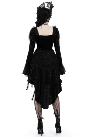 Black gothic velvet dress back view displaying shirred waist and layered ruffled high-low skirt design