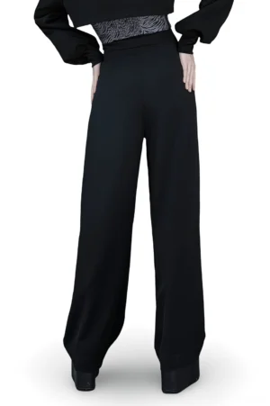 Black wide leg high-waisted gothic trousers rear full-length view showing dramatic silhouette and structured tailoring