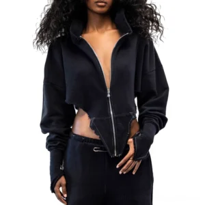 Black cropped zip-up gothic hoodie with thumb holes and raw hem detail, front view on model