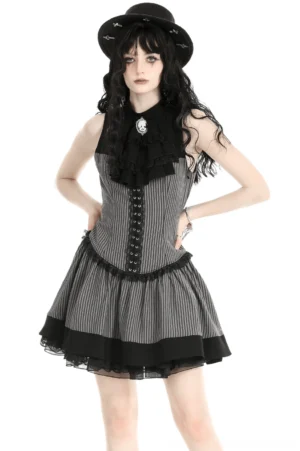 Black and gray striped gothic ruffle dress with skull cameo brooch - front full-body view on model with black hat