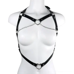 Black PU leather chest harness with crossed straps and silver heart-shaped center buckle, mannequin display