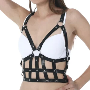 Black leather harness top piece with crisscross shoulder straps and adjustable buckles detail
