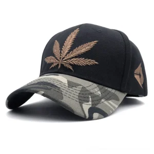 Black gothic baseball cap with brown hemp leaf embroidery and camouflage patterned brim front angle