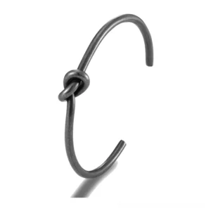 Black stainless steel knot cuff bracelet side view close-up showing matte finish and minimalist knotted design detail