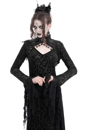 Black lace bolero with dramatic bell sleeves worn over velvet dress by gothic model, front view showcasing floral lace and theatrical sleeves