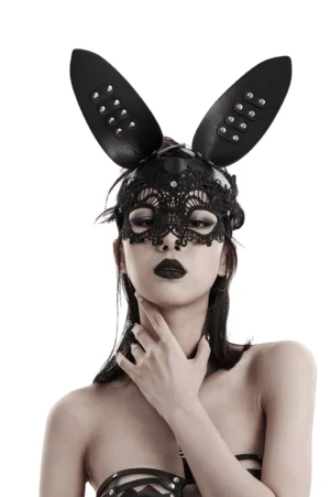 Black gothic lace bunny mask with 3D studded leather ears worn by model with dark makeup, front close-up studio shot