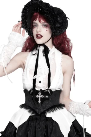 Black lace corset belt with silver cross embroidery worn on red-haired goth model in studio, front three-quarter view showcasing ornate cross detail and tulle trim