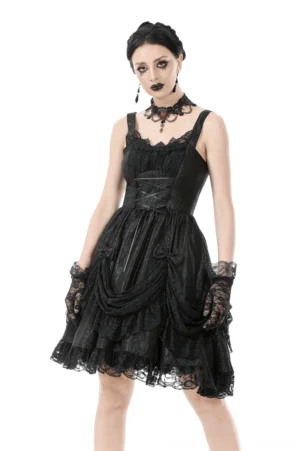 Black gothic lace slip dress with ruffled lace hem, front three-quarter view worn by model