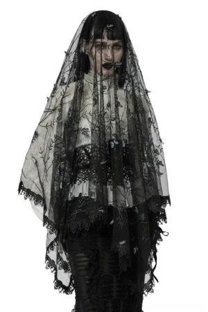 Black lace gothic butterfly veil worn by alternative fashion model, front view showing 3D embroidered blue butterflies and floral vine details with scalloped lace trim