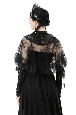Black lace capelet back view showing sheer floral lace panel and hanging tie straps, gothic fashion model studio shot